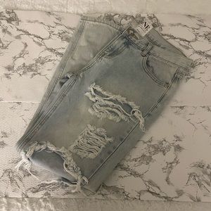 Distressed light washed denim.